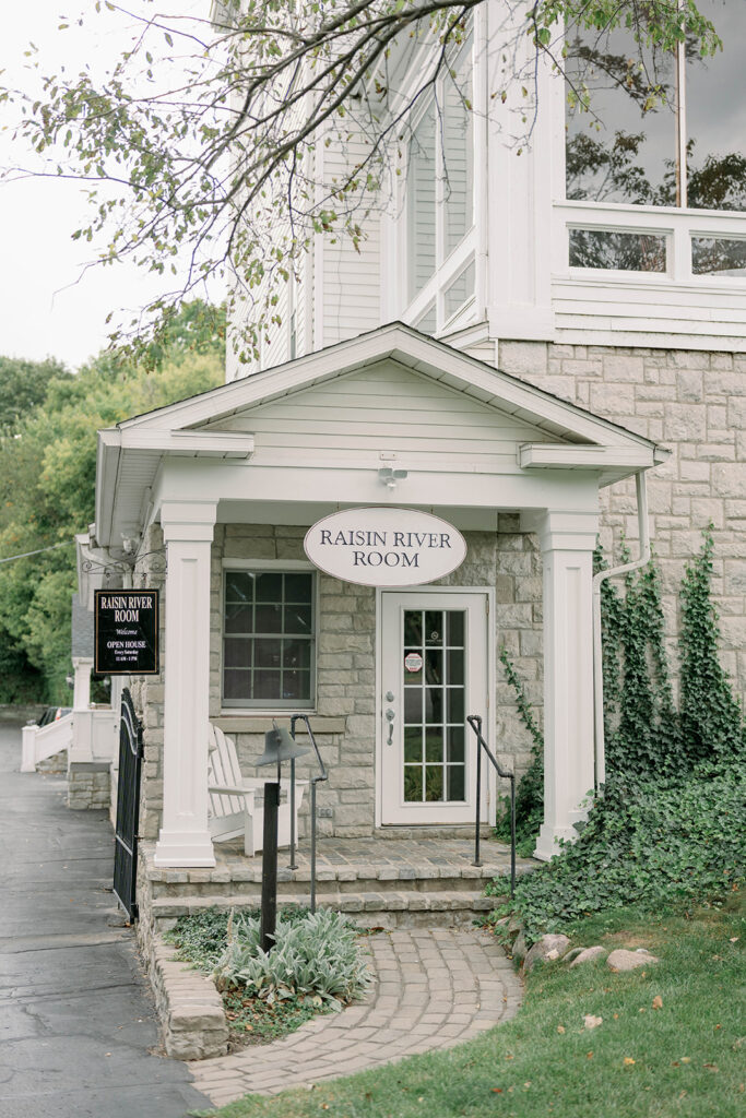 Exterior entrance of Wellers Weddings in Saline Michigan with historic architecture and charming garden pathway
