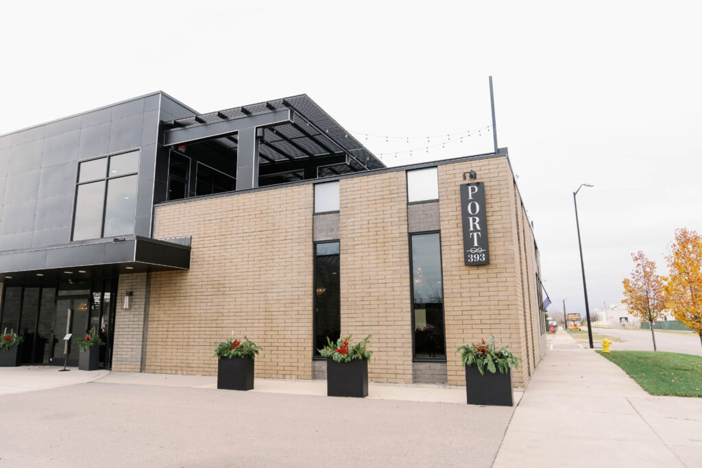 Exterior of Port 393 wedding venue in Holland Michigan with modern architecture and rooftop event space