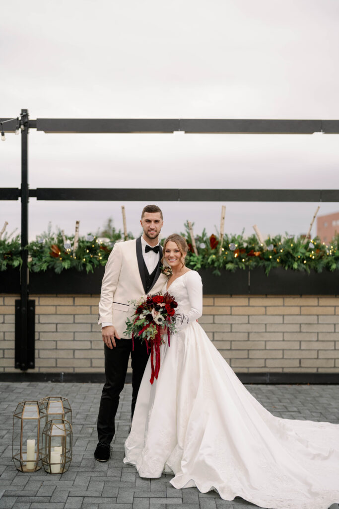 Couple standing outside Port 393 in Holland with modern urban style backdrop