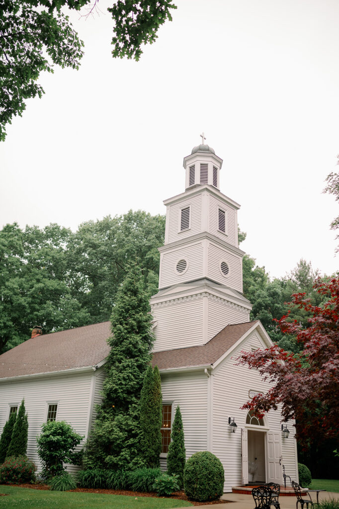 Exterior of The Morris Estate Chapel in Niles Michigan surrounded by trees and classic architectural details