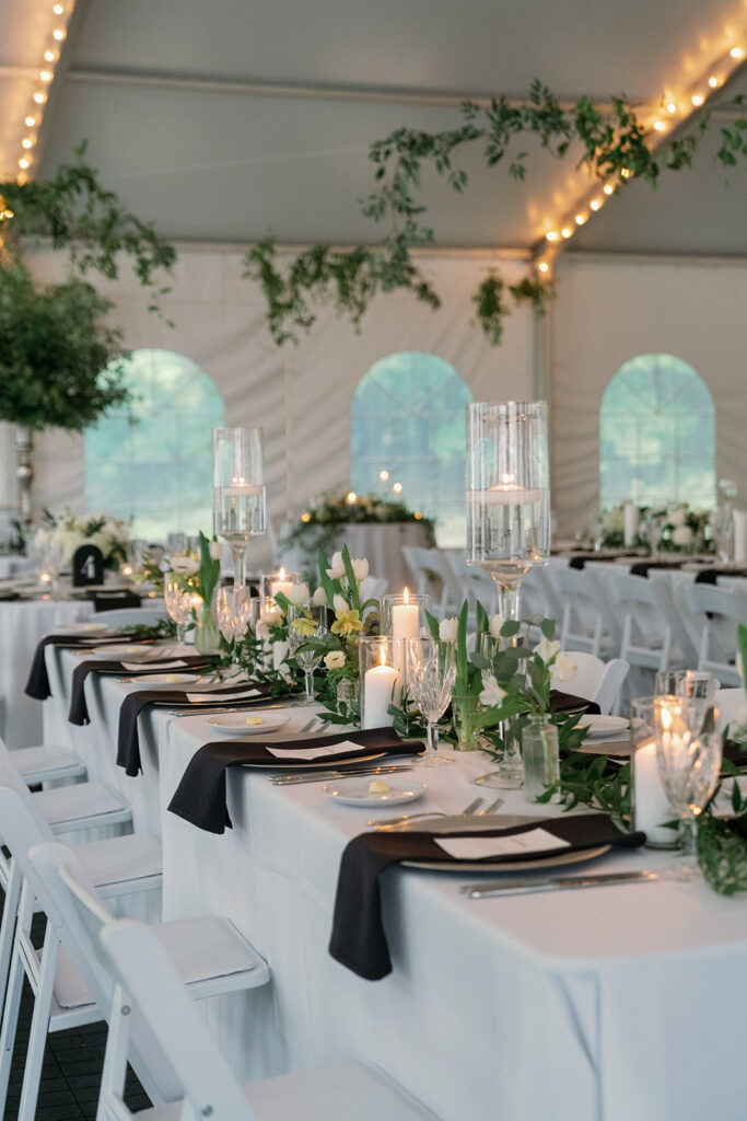 Reception setup at The Morris Estate with greenery filled tables inside a classic and elegant wedding venue