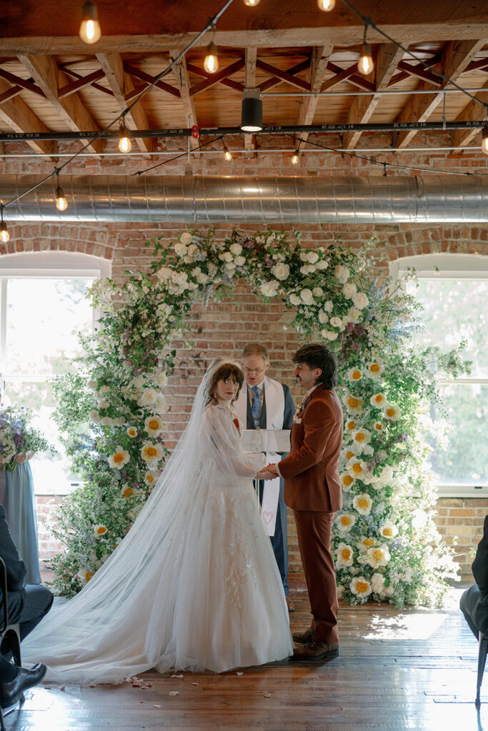ceremony moment bride and groom at altar Record Box Loft