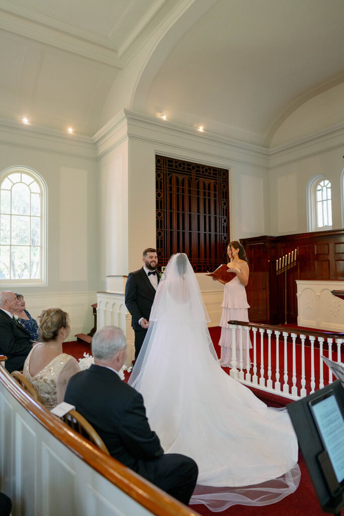 bride standing in chapel light Greenfield Village wedding Dearborn Michigan