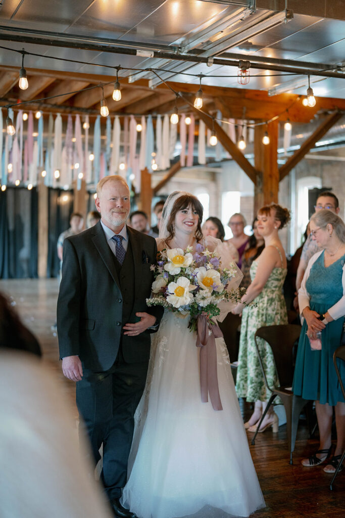 bride walking down aisle with guests watching Battle Creek Michigan