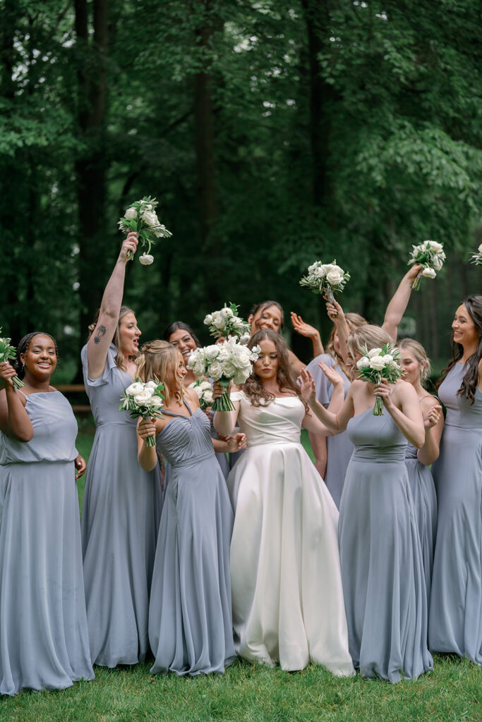 bridesmaids cheering with bouquets Morris Estate wedding