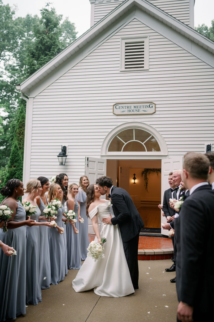 bride and groom kissing outside Morris Estate wedding chapel
