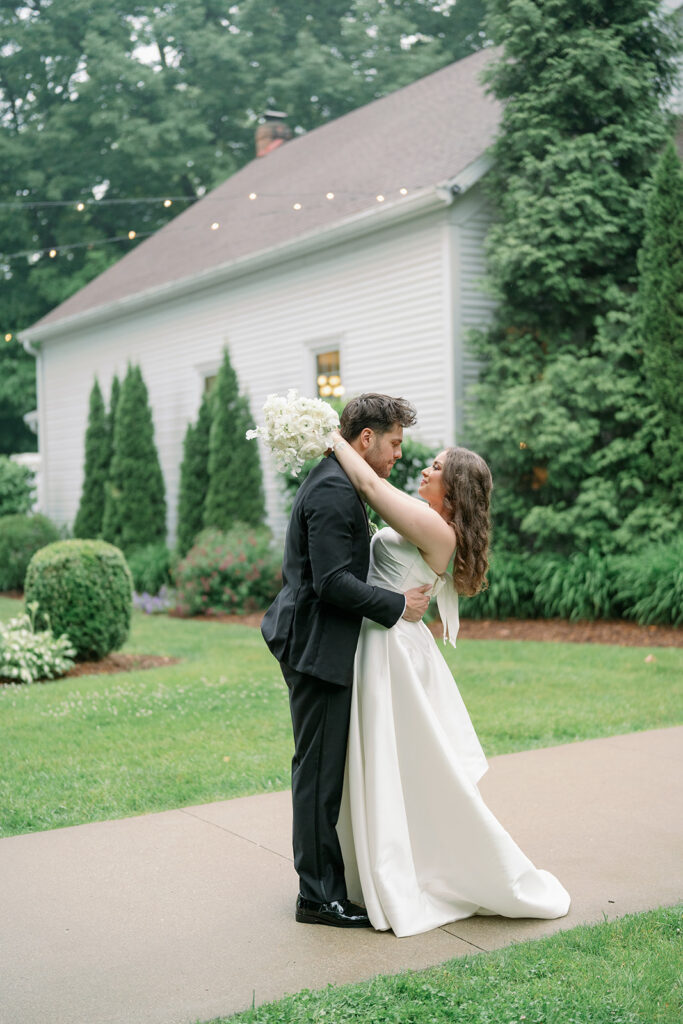 couple holding hands walking on road Morris Estate wedding photos