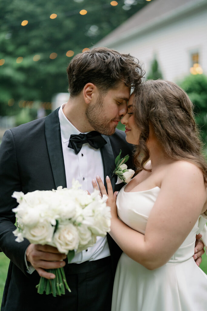 bride and groom kissing outside chapel Morris Estate wedding Michigan