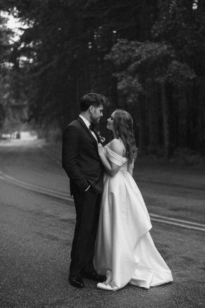 couple holding hands walking on road Morris Estate wedding photos