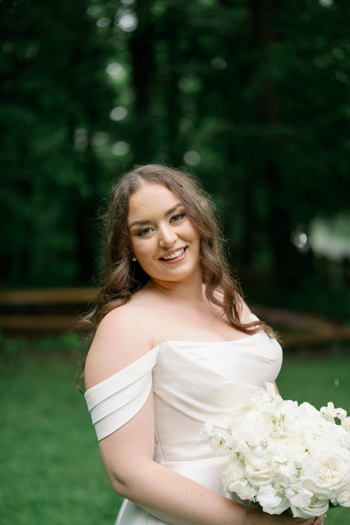 bride smiling holding bouquet outdoor portrait Morris Estate
