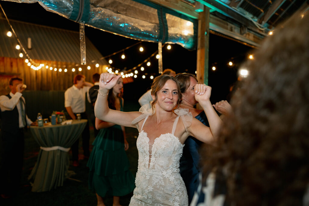 bride dancing during reception at Nugent Orchards wedding in Michigan