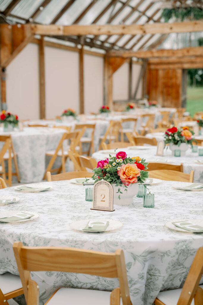 wedding table decor with candles and greenery at orchard venue
