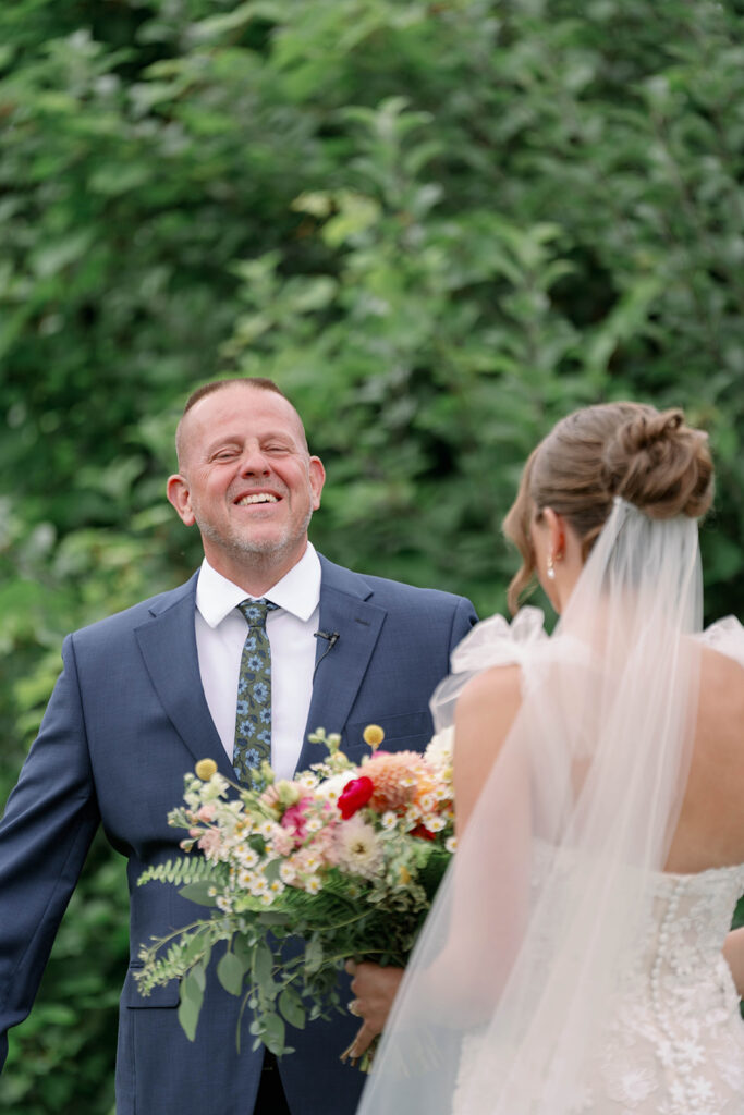 father reacting emotionally to seeing bride in wedding dress at Nugent Orchards wedding