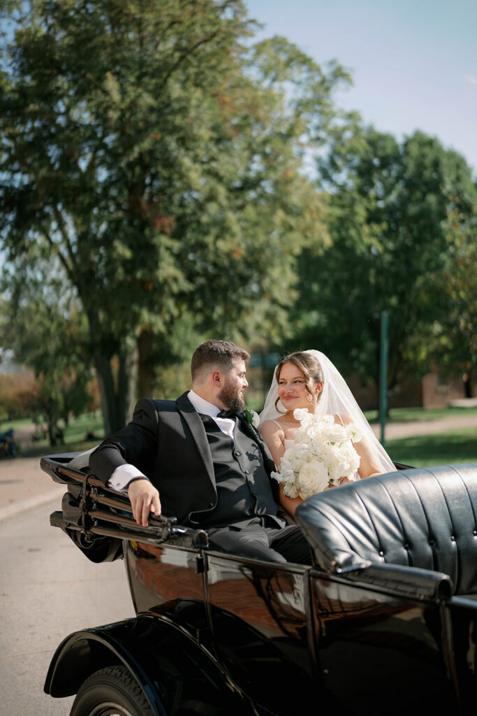 bride and groom in vintage car at Greenfield Village Dearborn Michigan wedding