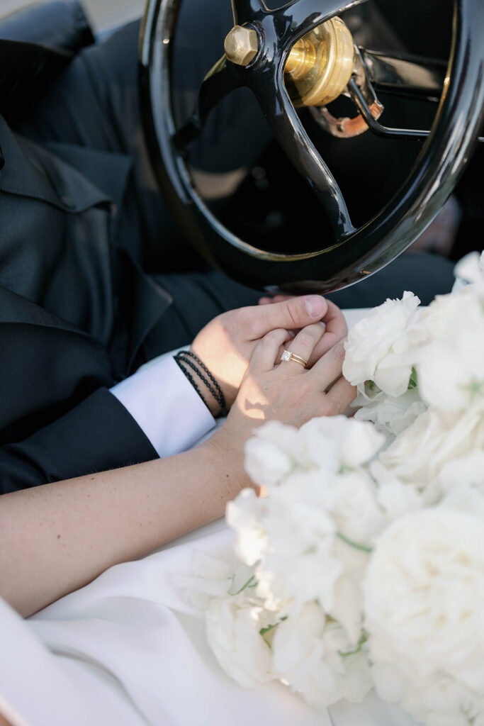 wedding detail shot rings and bouquet vintage car Michigan