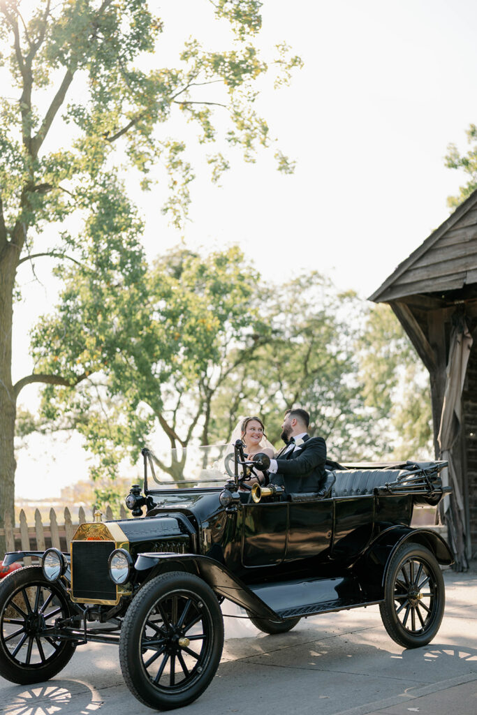 bride and groom by antique car outdoor portraits Dearborn MI