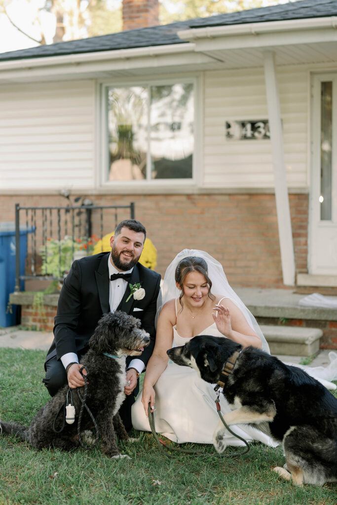 bride and groom photo with their dogs 