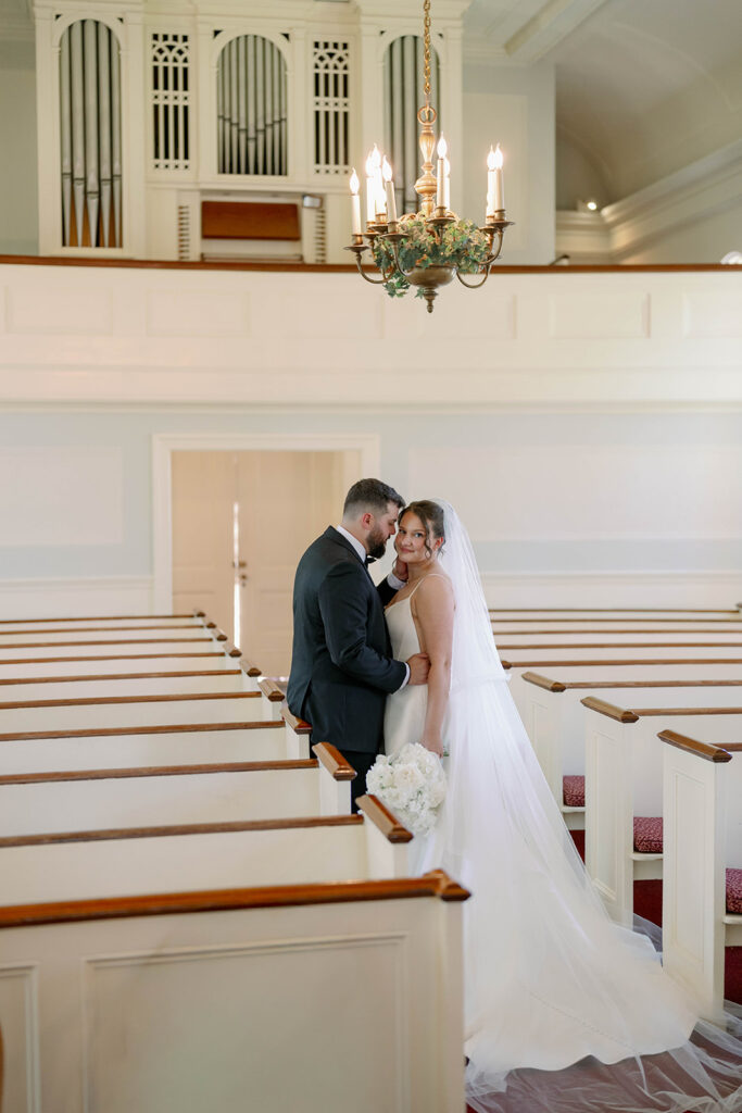 bride and groom first look inside chapel Dearborn Michigan wedding