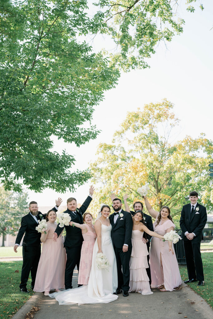 celebratory bridal party photo at Dearborn Village Wedding 
