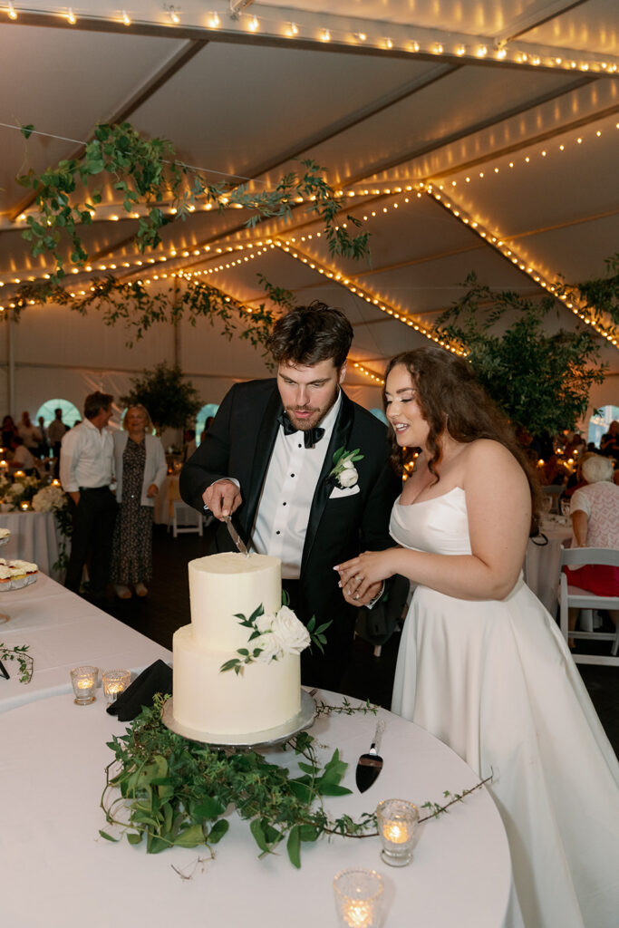 bride and groom cutting cake Morris Estate reception Michigan