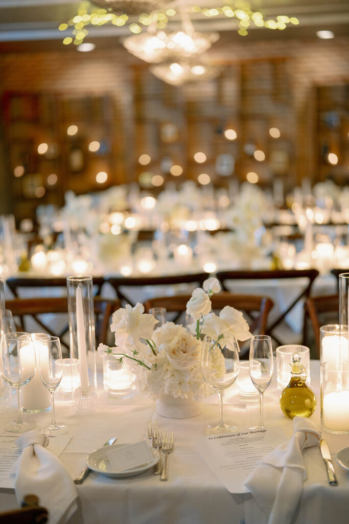 candlelit reception table details with florals at Cafe Cortina wedding in Dearborn Michigan