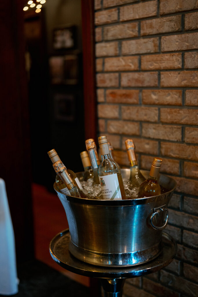wine bottles on ice during Cafe Cortina wedding reception in Dearborn Michigan