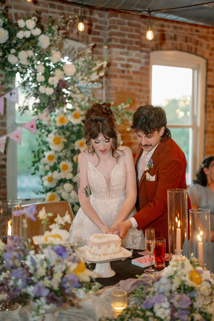 bride and groom cake cutting moment wedding reception Michigan