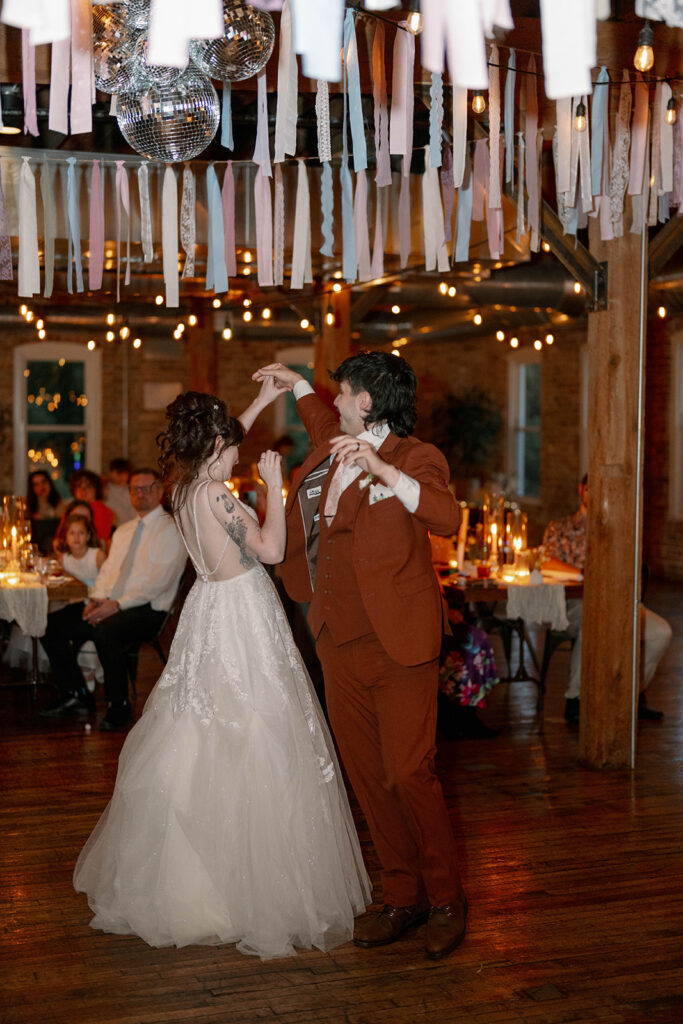 reception decor with hanging ribbons and disco balls wedding Michigan
