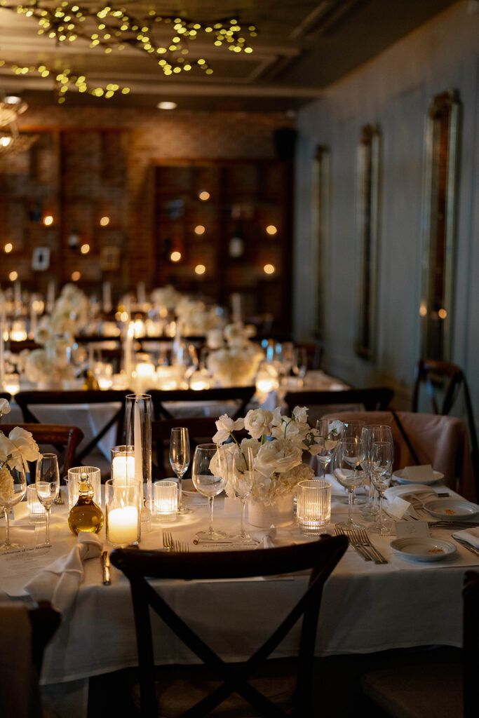 romantic wedding reception setup at Cafe Cortina with candles, florals, and warm lighting in Dearborn Michigan