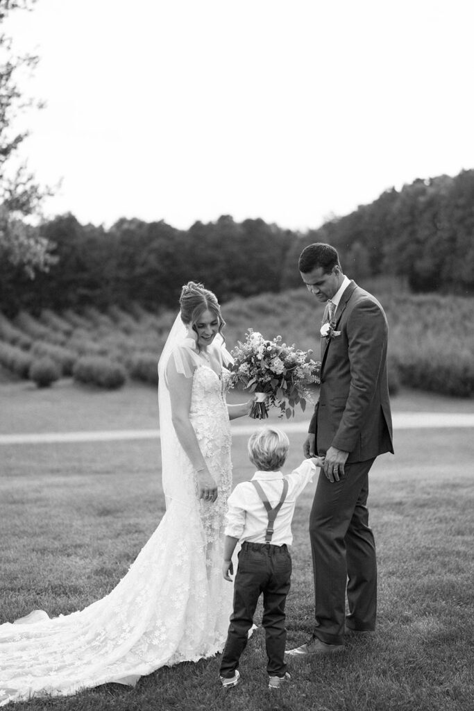 ring bearer giving rings during ceremony at Nugent Orchards wedding